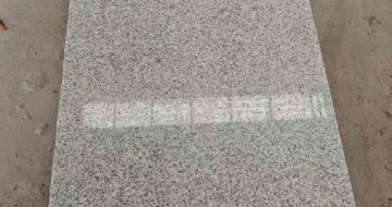 伊春芝麻白光面毛板